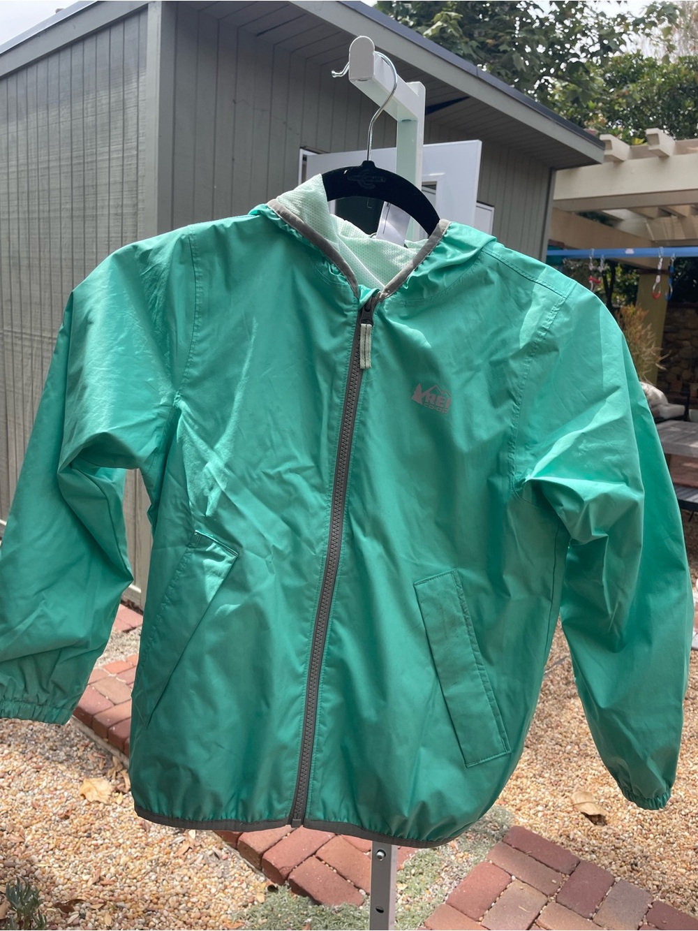 REI Kids' Hooded rain Jacket in Teal Green